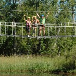 crossing pond on suspension bridge in wisconsin