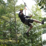 man ziplining in door county