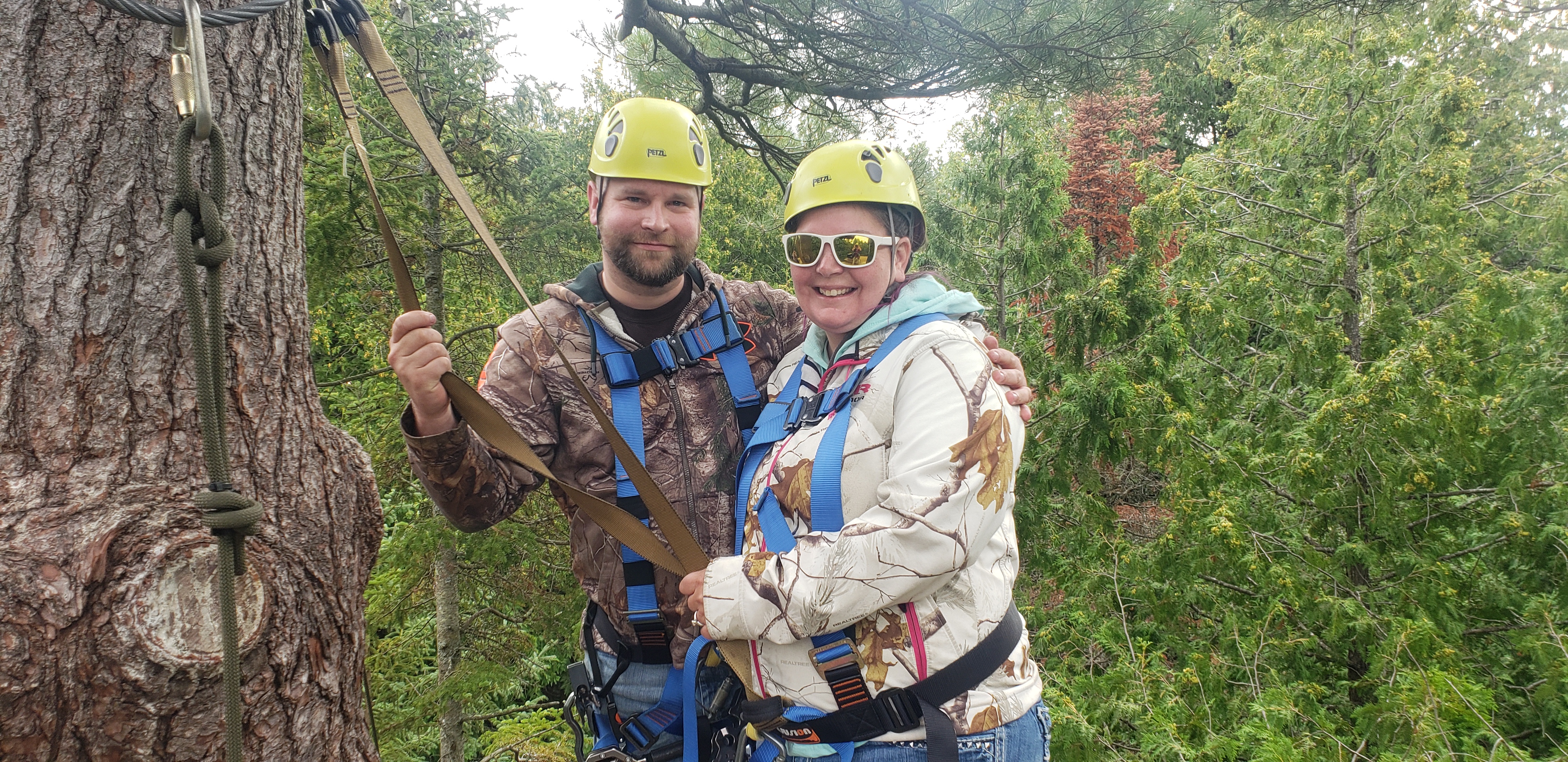 couple ziplining in wisconsin forests